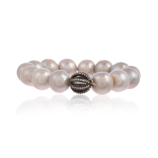 Pearl stretchy bracelet with real silver and cz bead