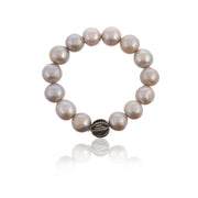 Pearl stretchy bracelet with real silver and cz bead