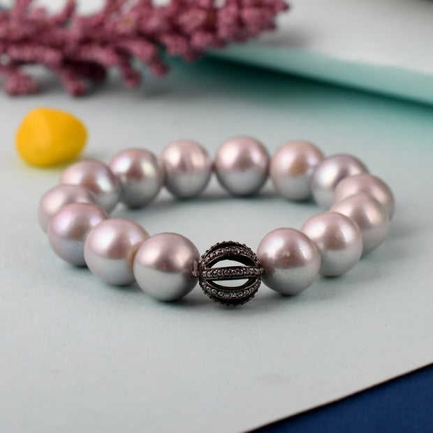 Pearl stretchy bracelet with real silver and cz bead